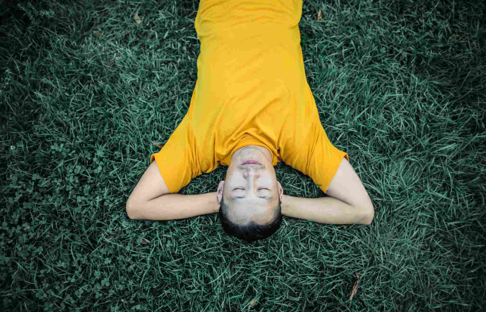 A man sleeping on the grass